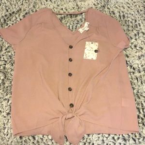 Pink button up front tie blouse.